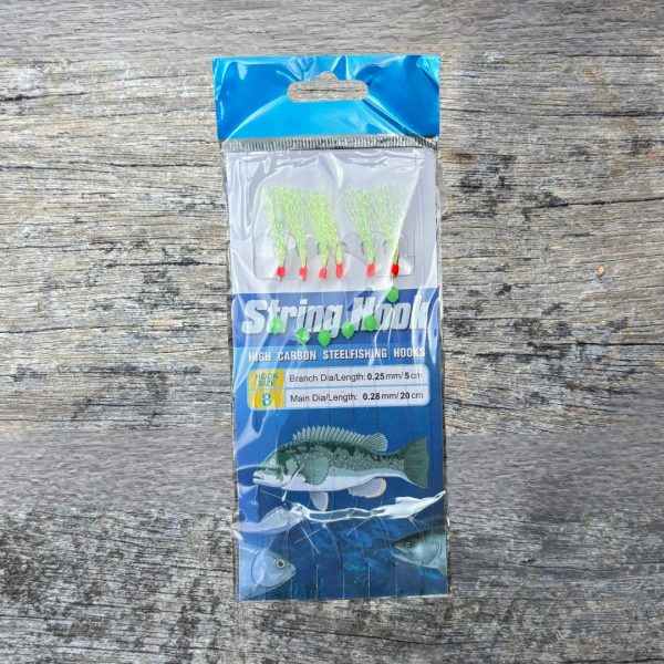 Green Sabiki rig against a wooden fishing wharf background